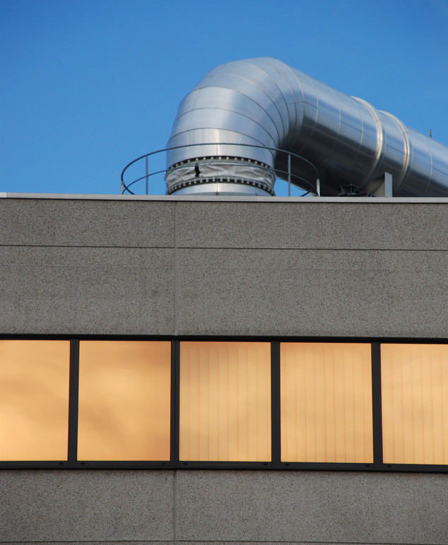 Industrial building with windows and aluminium pipe